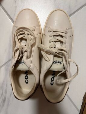 Coach Clip Leather Low Top Sneaker in the Chalk/Khaki colorway